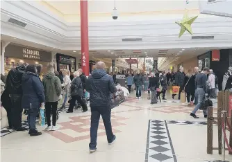  ??  ?? Shoppers flock into the Bridges yesterday.