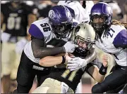  ?? Arkansas Democrat-Gazette/THOMAS METTHE ?? Ouachita Baptist defensive lineman Dameyun McDonald (56) tackles Harding quarterbac­k Preston Paden during the Tigers’ 7-3 victory Saturday night in Searcy.