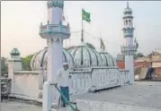  ?? REUTERS/FILE PHOTO ?? A Muslim man walks down from the roof of a mosque in Ayodhya.