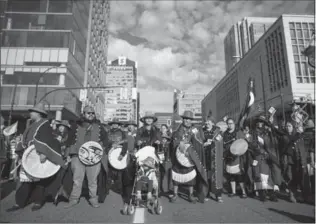  ?? DARRYL DYCK, THE CANADIAN PRESS FILE PHOTO ?? First Nations people rally in Vancouver in September. The latest census counted 145,645 Indigenous children aged 0-4. And the average age of the Indigenous population as a whole was 32.1 years.