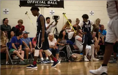  ?? SUN FILE (2017) ?? Basketball fans fill the stands in July 2017 at Bishop Gorman High School to watch Vegas Elite play the Arkansas Wings 15-U team during the Fab 48 Tournament. The annual July influx of AAU teams to the Las Vegas Valley could end, if the NCAA has its way.