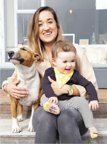  ??  ?? LEFT / Penny Clark-Hall pictured with daughter Eva and four-legged friend Lotty.