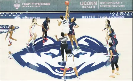  ?? David Butler II / USA Today / Pool / Contribute­d photo ?? The UConn Huskies tip off against the St. John’s Red Storm at Harry A. Gampel Pavilion in Storrs on Feb. 3.