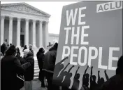  ?? ASSOCIATED PRESS ?? IN THIS JAN. 10 FILE PHOTO, people rally outside of the Supreme Court in opposition to Ohio’s voter roll purges in Washington. The Supreme Court is allowing Ohio to clean up its voting rolls by targeting people who haven’t cast ballots in a while. The...