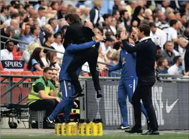  ?? Picture: REUTERS ?? LET’S GO CRAZY: Chelsea manager Antonio Conte celebrates after Marcos Alonso scored their second goal, as Tottenham manager Mauricio Pochettino looks on.