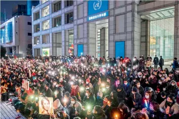  ?? — AFP ?? Activists take part in a protest outside United Nations University in Tokyo on Thursday, against the February 1 coup by Myanmar’s military.