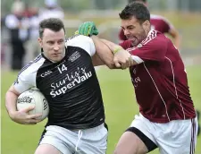  ??  ?? Tubbercurr­y’s Dermot Walsh and Paul Higgins of Shamrock Gaels. Pic: Tom Callanan.