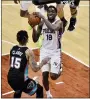  ?? BRANDON DILL - AP ?? 76ers guard Shake Milton (18) drives against Memphis Grizzlies forward Brandon Clarke (15) during the second half of an NBA game Saturday, in Memphis, Tenn.