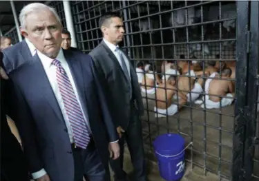  ?? PABLO MARTINEZ MONSIVAIS — ASSOCIATED PRESS ?? Attorney General Jeff Sessions walks past a cell during a tour of local Police Station and Detention Center in San Salvador, El Salvador, on Thursday.