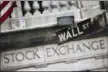  ?? ASSOCIATED PRESS FILE ?? A Wall Street street sign outside the New York Stock Exchange is shown.