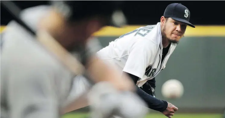  ?? — THE ASSOCIATED PRESS ?? Seattle Mariners starting pitcher Felix Hernandez throws against the New York Yankees during the third inning of Saturday’s game in Seattle.