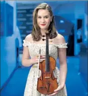  ?? Myung J. Chun Los Angeles Times ?? FINNISH violin student Laura Kukkonen, 18, won a contest to perform with star violinist Ray Chen.