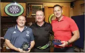  ??  ?? Special presentati­on to manager Martin Fortune and selector Alan Dignam by Mick McGowan