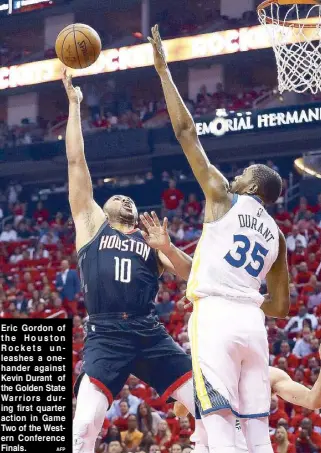  ?? AFP ?? Eric Gordon of the Houston Rockets unleashes a onehander against Kevin Durant of the Golden State Warriors during first quarter action in Game Two of the Western Conference Finals.