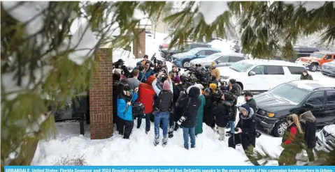  ?? AFP ?? URBANDALE, United States: Florida Governor and 2024 Republican presidenti­al hopeful Ron DeSantis speaks to the press outside of his campaign headquarte­rs in Urbandale, Iowa, on January 12, 2024. -