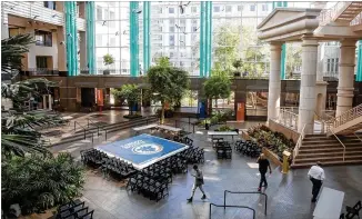  ?? PHOTOS BY PHIL SKINNER ?? The atrium at the Fulton County Government Center was viewed by many as a sign of excess when the $70 million building that came to be known as the Crystal Palace, or Taj Mahal, opened in 1990. The nonfunctio­ning features “set a tremendous bad first impression,” one Fulton County official said.