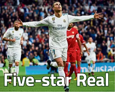  ?? — AFP ?? Liberating: Real Madrid’s Cristiano Ronaldo celebratin­g after scoring one of his two goals against Sevilla at the Bernabeu on Saturday.