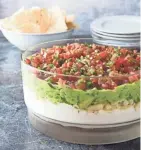  ?? JOE KELLER/AMERICA'S TEST KITCHEN ?? This Ultimate 7-Layer Dip has a Southweste­rn accent.