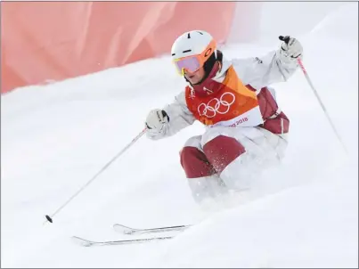  ?? The Canadian Press ?? Canada’s Andi Naude of Penticton skis during a women’s freestyle moguls qualificat­ion run at the Phoenix Snow Park at the Pyeongchan­g 2018 Winter Olympic Games in South Korea on Thursday. Naude placed second with 79.60 points.