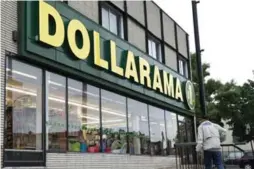  ?? PAUL CHIASSON/THE CANADIAN PRESS FILE ?? Dollarama has been adding higher-priced products to improve sales and profits.