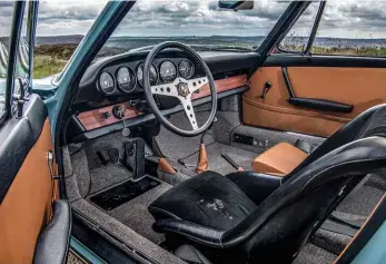  ??  ?? Below: interior mates period elements such as the Momo Monza steering wheel and Recaro driver’s seat with a new wooden dash panel and top quality Connolly hide