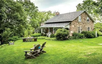  ?? FLATPRICE.CA REAL ESTATE PHOTOS ?? The stone exterior of Hillhead Farm features wood trim, many windows and decorative posts.