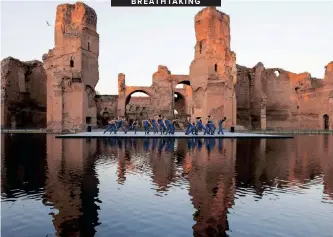  ?? REMO CASILLI ?? DANCERS perform at the new pool of the ancient Roman public bath complex Baths of Caracalla (Terme di Caracalla) during its preview to the media, prior to the official inaugurati­on, in Rome, Italy, this week. I Reuters