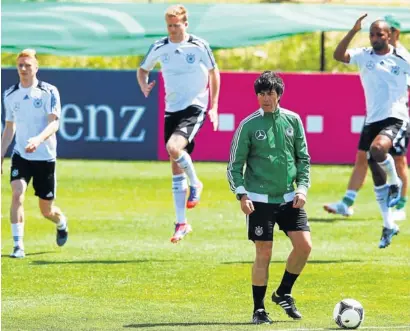  ?? Picture: GETTY IMAGES ?? GETTING THE BALL ROLLING: Head coach Joachim Loew watches players exercise during a Germany training session at Campo Sportivo Comunale Andrea Dora in Olbia, Italy