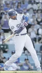  ??  ?? MATT KEMP connects for a walk-off double Sunday, one day after a gamewinnin­g homer off the same pitcher.