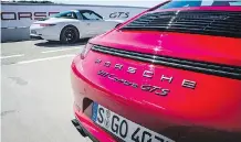  ??  ?? Porsche’s 911 Carrera GTS coupe is the champ on the track.