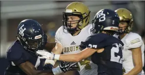  ?? NWA Democrat-Gazette/BEN GOFF ?? Hudson Henry (middle), shown last season with Pulaski Academy against Springdale Har-Ber, said he was tempted by Stanford in the recruiting process, but that “Arkansas was always my number one option in the back of my mind.”