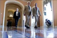  ?? Andrew Harnik/Associated Press ?? Senate Minority Leader Mitch McConnell, of Kentucky, walks to the Senate chamber as the infrastruc­ture bill nears passage in Washington on Monday.