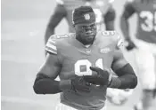  ??  ?? Dolphins defensive end Emmanuel Ogbah walks off the field after Miami’s game vs. the Chiefs at Hard Rock Stadium on Dec. 13, 2020.