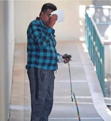  ?? Picture: BRIAN CASSEY ?? ACCUSED: Larry Woosup leaves Cairns police watch house yesterday morning after being granted bail on fraud charges.