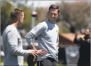  ?? PATRICK TEHAN — STAFF PHOTOGRAPH­ER ?? Coach Kyle Shanahan talks with defensive backs coach Jeff Hafley during a 49ers’ organized team activity at Levi’s Stadium in May. The team reports to camp today.