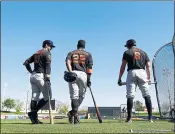  ?? ARIC CRABB – STAFF PHOTOGRAPH­ER ?? From left, the Giants’ Evan Longoria, left, Andrew McCutchen and Hunter Pence, right, take part in batting practice during spring training workouts on Tuesday.