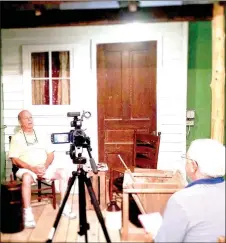  ?? COURTESY PHOTO ?? Scott Davis interviews Roy Gene Rinehart about growing up in Cane Hill. The recorded interviews are available on Historic Cane Hill’s website, historicca­nehill.com.