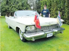  ??  ?? Langley’s Llew Hunter shows off the royal tour 1958 Chrysler Imperial Crown convertibl­e his father bought more than 40 years ago.