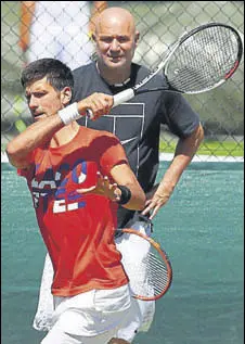  ?? GETTY IMAGES ?? Novak Djokovic trains with coach Andre Agassi at the All England Club on Sunday