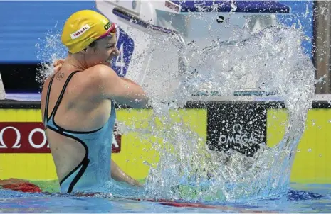  ??  ?? MAKING A SPLASH: Emily Seebohm reacts after winning the 200m backstroke at the World Championsh­ips. PHOTO: AAP