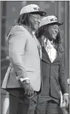  ?? JAE S. LEE/DALLAS MORNING NEWS VIA AP ?? Shaquem Griffin, left, and his twin brother, Seattle cornerback Shaquill Griffin pose Saturday on stage during the NFL draft in Arlington, Texas. The Seahawks selected Shaquem in the fourth round.