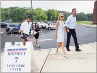  ?? Tyler Sizemore / Hearst Connecticu­t Media file photo ?? Then-candidate Ned Lamont and his wife, Annie, enter the Greenwich District 7 polling center to vote in the primary election at Greenwich High School on Aug. 14, 2018. The two live in town and were spotted dining together at Hinoki this past week.