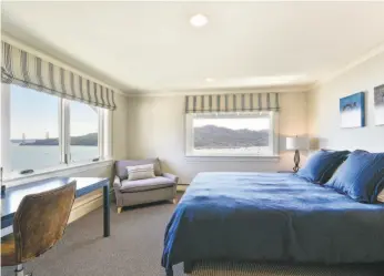  ?? Photos by Open Homes Photograph­y ?? Left: The formal dining room at 244 Golden Gate Ave. in Belvedere offers a beamed ceiling and a bay window. Right: Golden Gate Bridge views await in this bedroom.