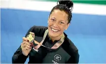  ??  ?? Sophie Pascoe poses with her second swimming gold medal.