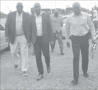  ?? ?? Project Director for CONCACAF, Howard McIntosh entering the site that will eventually be the home for Guyana’s first football stadium alongside members of the GFF inclusive of President Wayne Forde