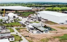  ?? William Luther/Staff photograph­er ?? Homes and a recreation area are seen March 21, 2023, behind Elon Musk’s The Boring Company in Bastrop County.