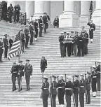  ?? POOL PHOTO BY ALEX BRANDON/AP ?? A military honor guard carries President George H.W. Bush’s casket from the U.S. Capitol on Wednesday.