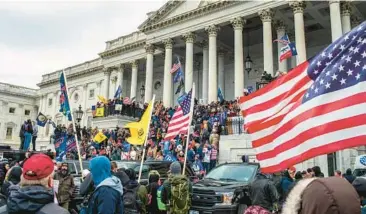  ?? JASON ANDREW/THE NEW YORK TIMES ?? Supporters of then-President Donald Trump storm the U.S. Capitol on Jan. 6, 2021.