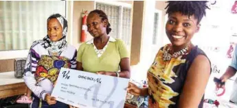  ??  ?? Expectant and nursing mothers who benefited from the V14’s Giving Back event receiving their cheques from Mrs. Hynes