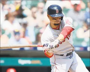  ?? Duane Burleson / Getty Images ?? The Red Sox’s Mookie Betts singles against the Tigers during the seventh inning on Sunday at Comerica Park in Detroit.